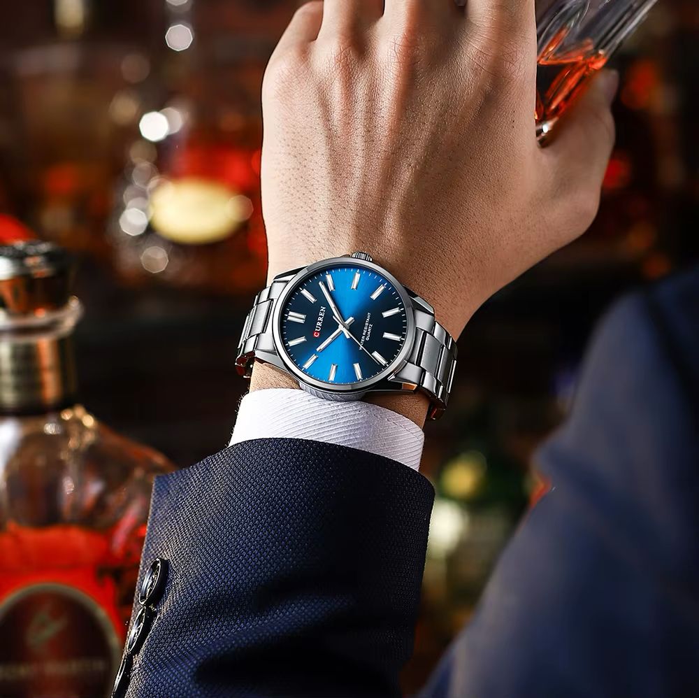 a woman wearing sunglasses and a turban with flowers on her head